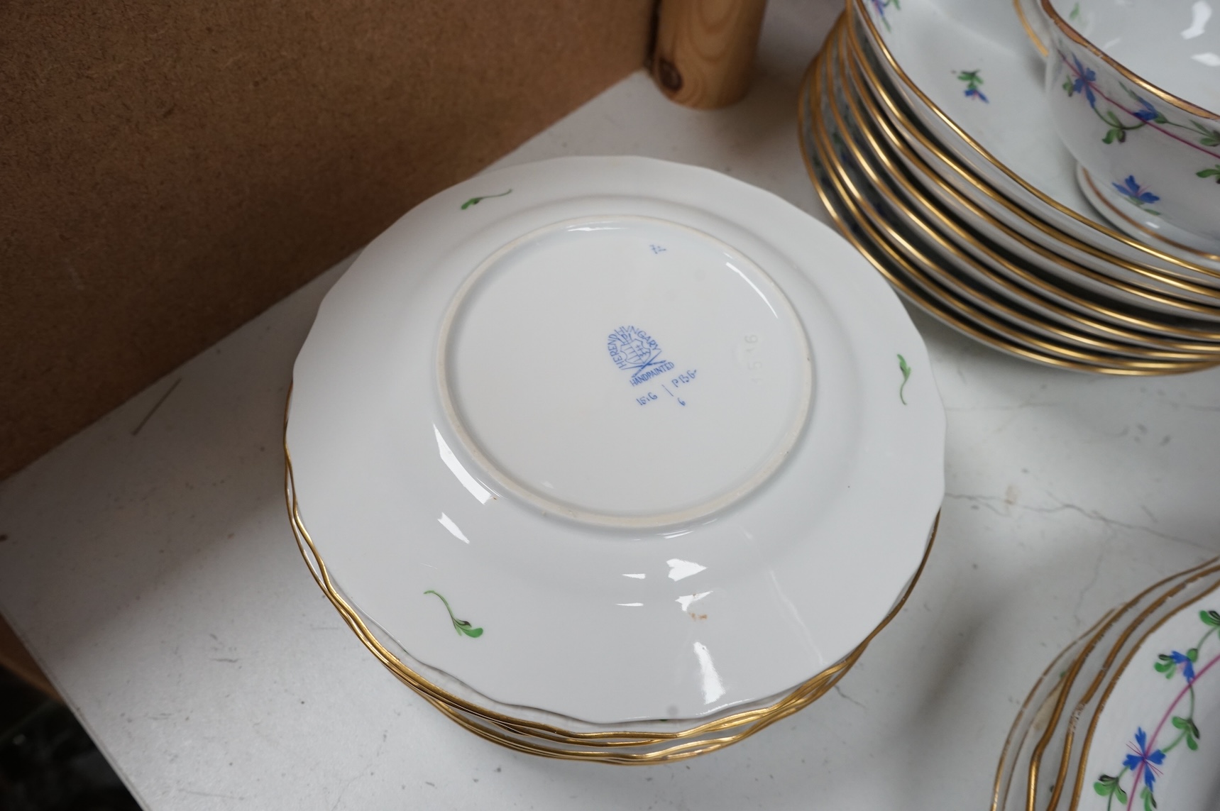A Herend blue garland part tea set to include plates, twin handles cups and crescent dishes, largest 23cm in diameter